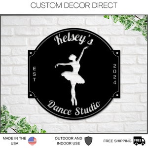 May include: Black metal sign with a white silhouette of a ballerina, the text "Kelsey's Dance Studio" and the year "2024".
