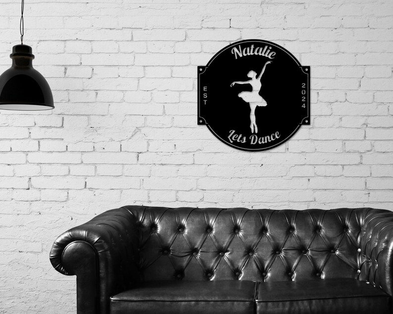 May include: Black metal sign with a white silhouette of a ballerina, the text "Natalie" at the top, "Lets Dance" at the bottom, and "EST 2024" on the sides.