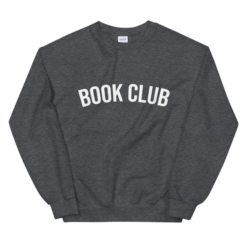 May include: A dark grey sweatshirt with the text "BOOK CLUB" printed in white on the front.
