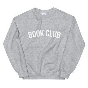 May include: A gray sweatshirt with the text "BOOK CLUB" printed in white on the front.