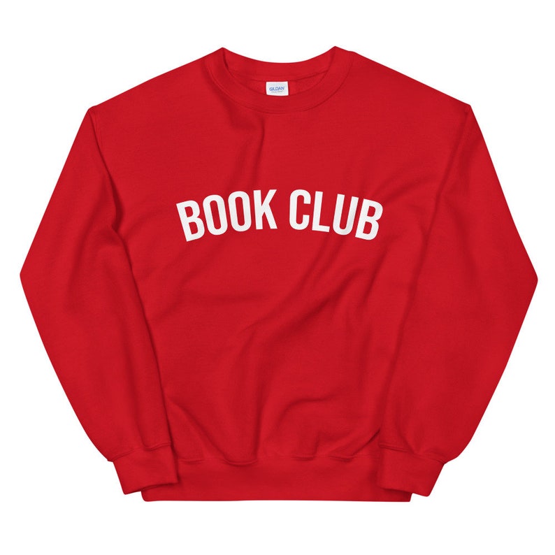May include: Red sweatshirt with the text "BOOK CLUB" in white letters.