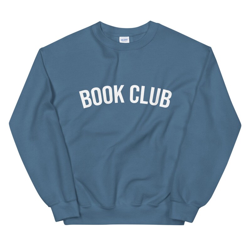 May include: A blue sweatshirt with the text "BOOK CLUB" in white letters.