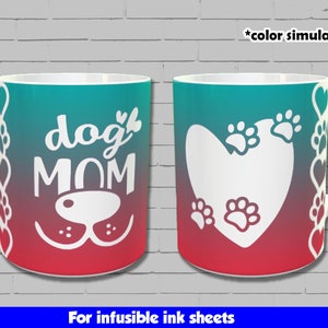 May include: Two white ceramic mugs with a gradient design. One mug features the text "dog mom" with a dog nose and paw prints. The other mug features a white heart with paw prints. Both mugs are for infusible ink sheets.