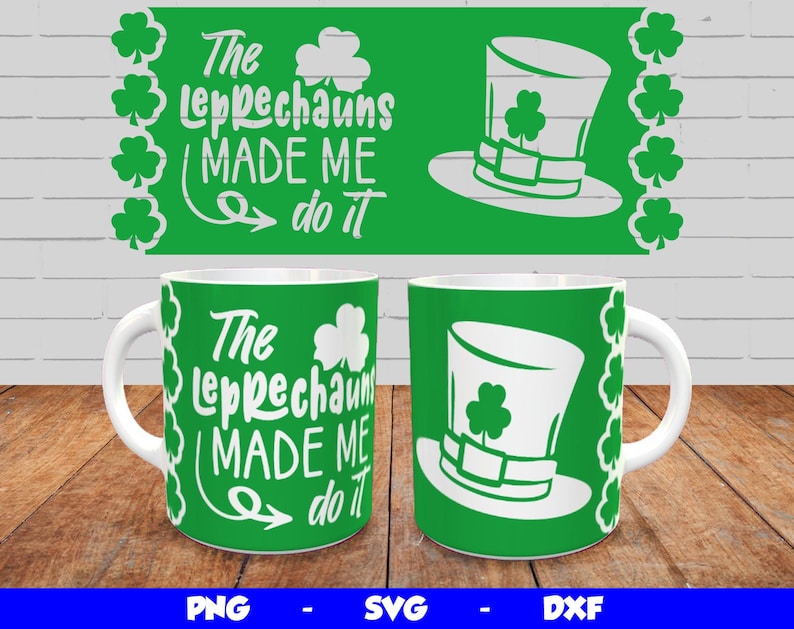May include: Two white mugs with green backgrounds and white text that reads "The Leprechauns Made Me Do It". One mug has a green shamrock hat on it.