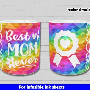 May include: Two white ceramic mugs with a rainbow geometric pattern. One mug says "Best Mom Ever" with a flower and hearts. The other mug has a white ribbon with a heart in the centre. Both mugs are for infusible ink sheets.