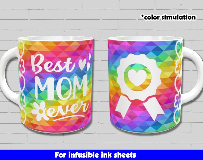 May include: Two white ceramic mugs with a rainbow geometric pattern. One mug says "Best Mom Ever" with a flower and hearts. The other mug has a white ribbon with a heart in the centre. Both mugs are for infusible ink sheets.