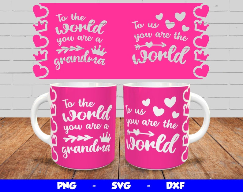 May include: Two pink mugs with white text and graphics. The text on the mugs reads "To the world you are a grandma" and "To us you are the world".