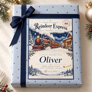 May include: A light blue gift box wrapped with a dark blue ribbon and bow, featuring a Reindeer Express label addressed to Oliver from Santa Claus, with a steam train illustration, snowy landscape, and a Nice List Approved checkbox.