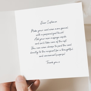 May include: A white card with black text that reads "Dear Customer. Make your card even more special with a personalized touch! Add your own message inside. and we'll take care of the rest. You can even choose to send the card directly to the recipient for a thoughtful and convenient surprise! Thank you x"