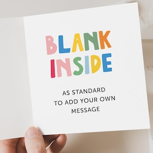 May include: A blank greeting card with the words "BLANK INSIDE" in colorful letters. The text "AS STANDARD TO ADD YOUR OWN MESSAGE" is printed below the colorful letters.