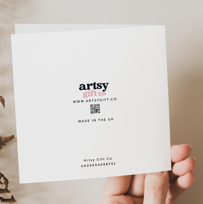 May include: White card with black text that reads "artsy gift co" and "www.artsygift.co". A black and white QR code is below the website address. The text "MADE IN THE UK" is below the QR code. The text "Artsy Gift Co UK00004098741" is at the bottom of the card.
