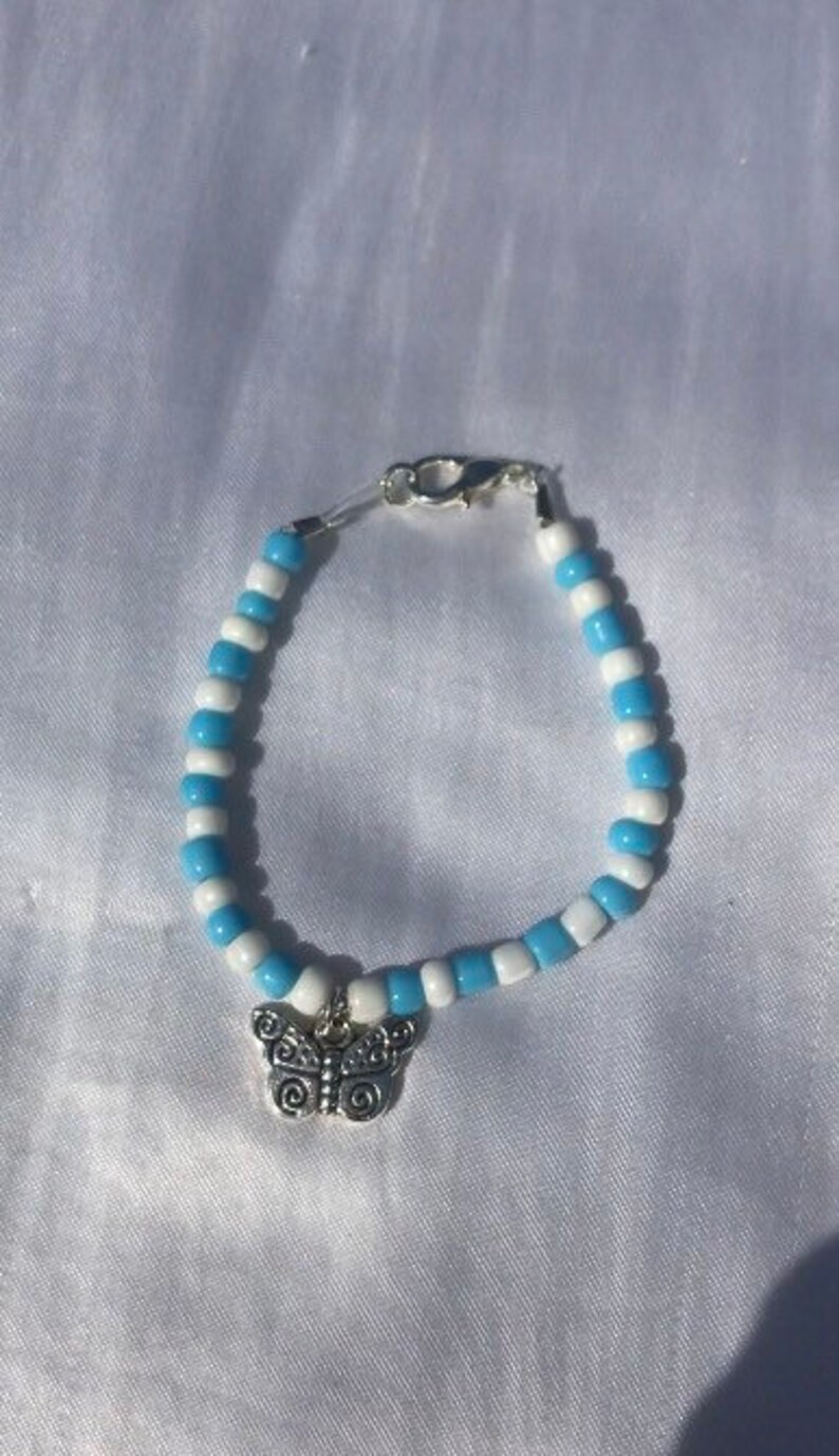 bead bracelet with butterfly charm