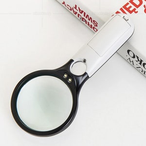 Magnifier with lights.  Two magnification with 3 dedicated LED lights.  3x and 45x.  Handheld easily.