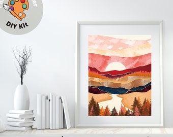 May include: A framed print of a watercolor painting depicting a sunset over a mountain range with a river flowing through the valley. The colors are mostly red, orange, and yellow, with some green trees in the foreground.