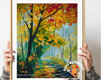 Peut inclure: Un kit de peinture par numéros encadré représentant un paysage d'automne coloré avec un chemin menant au loin. L'œuvre d'art comprend un arbre aux feuilles jaunes et rouges. Le texte sur l'image indique "CRÉEZ VOTRE PROPRE ART PEINT À LA MAIN AVEC CE KIT DIY FACILE."