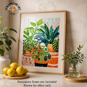 May include: A framed botanical print depicting lush green plants in orange pots. The artwork showcases diverse foliage, with the text "YUKA DECOR ART" and "Paint By Number DIY Kit". Lemons and a small plant are in the foreground. The frame is not included.