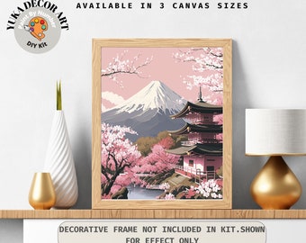 May include: A paint by numbers kit featuring a Japanese landscape with Mount Fuji, cherry blossoms, and a pagoda. The kit is available in three canvas sizes.  "AVAILABLE IN 3 CANVAS SIZES" and "DECORATIVE FRAME NOT INCLUDED IN KIT.SHOWN FOR EFFECT ONLY" are printed on the image.