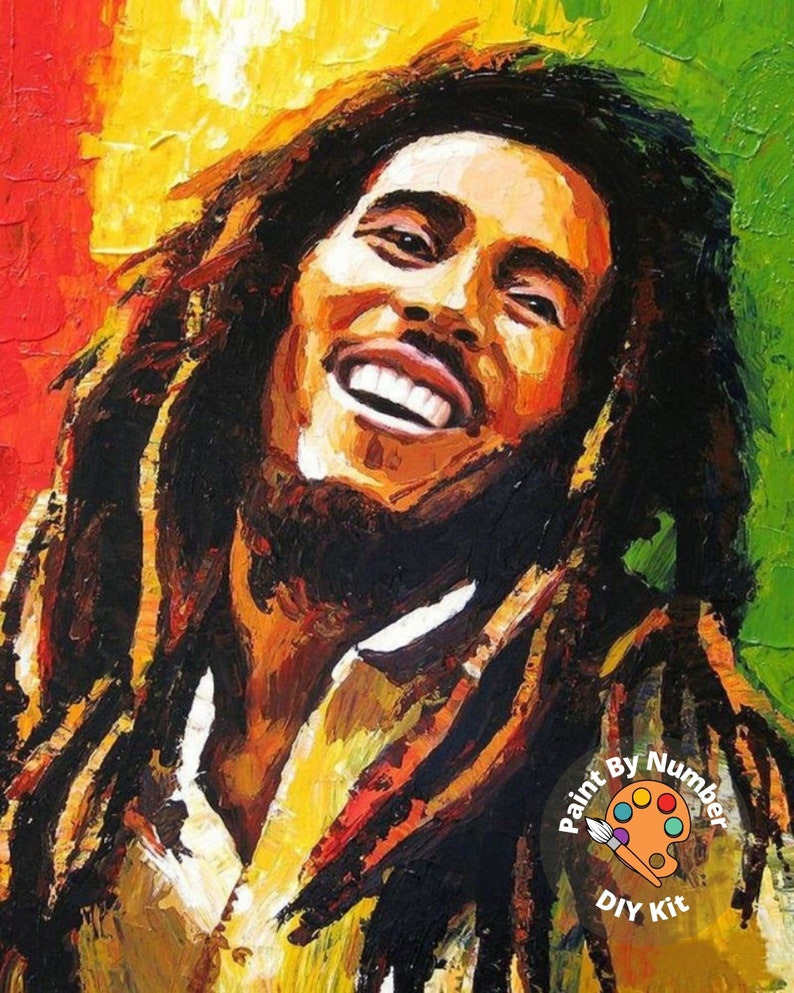 May include: A paint by numbers kit featuring a colorful portrait of Bob Marley. The image shows a close-up of his face with a bright smile and dreadlocks. The kit includes a paint palette, brushes, and a canvas with numbered sections.