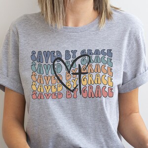 Trendy Christian Shirts, Saved by Grace Christian T Shirts for Women, Retro Christian shirts, faith based shirts, Bible Verse Shirt, faith