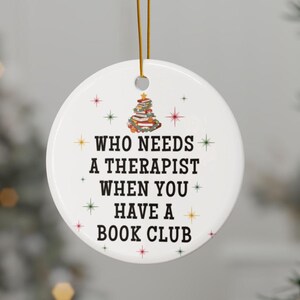 book club ornament, gift for girls in book club. Its says who needs a therapist when you have a book club. it has a stack of christmas books in a Christmas theme