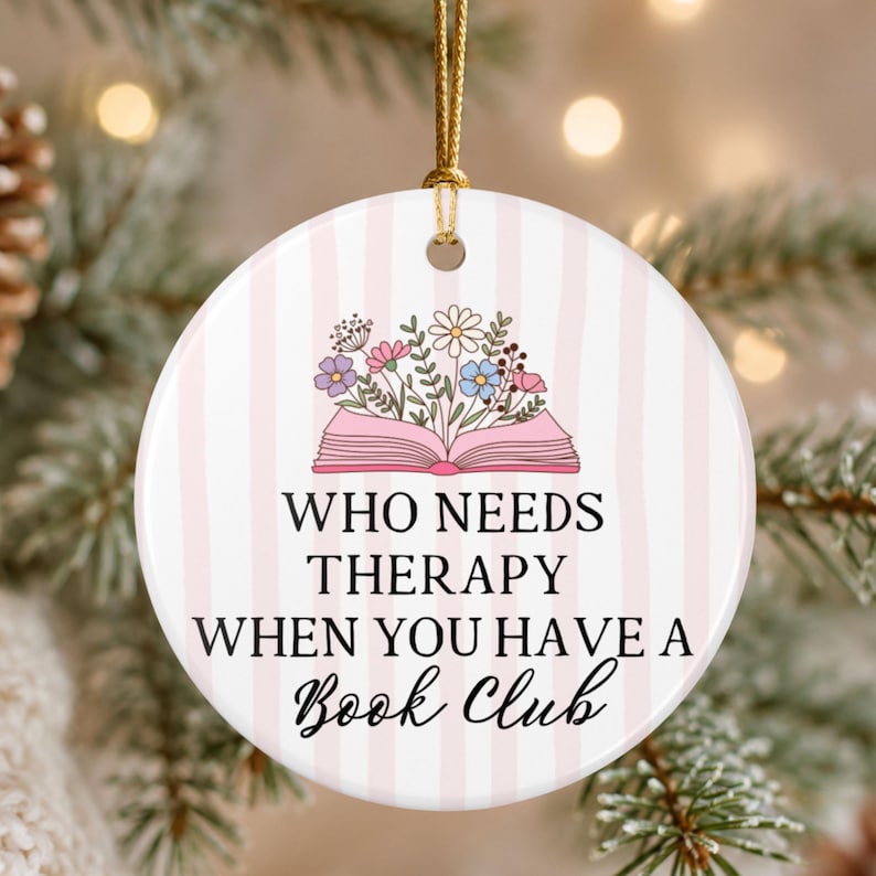 Funny book club Christmas ornament with a pink striped background, floral open book illustration and the saying Who Needs Therapy When You Have a Book Club