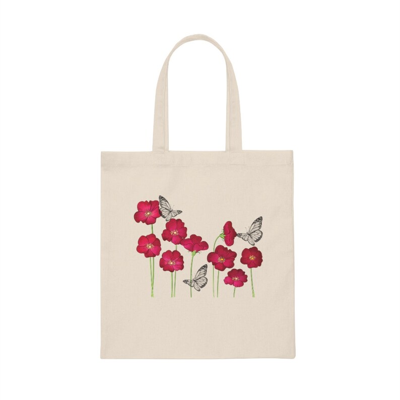 May include: A white canvas tote bag with a design of red flowers and white butterflies.