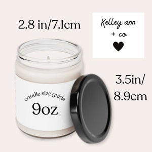 May include: A 9 ounce candle in a clear glass jar with a black lid. The candle is labelled "candle size guide 9oz". The jar is 7.1 cm in diameter and 8.9 cm tall. A separate label reads "Kelley ann + co" with a black heart.