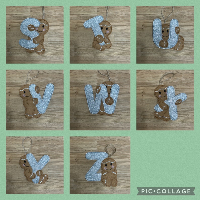 May include: Nine silver glitter letters of the alphabet, S, T, U, V, W, X, Y, and Z, each with a gingerbread man holding the letter. The gingerbread men are brown and have a white face with a smile.