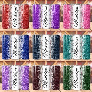 May include: Nine different colour variations of a personalised stainless steel tumbler with a glitter design. The tumbler has a white background with the name "Madelyn" written in black cursive.