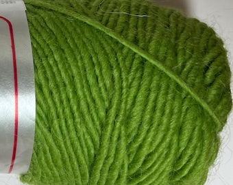 May include: A close-up of a ball of bright green yarn. The yarn is tightly wound, showing the texture of the fibers. The color is a vibrant, spring-like green, perfect for knitting or crocheting projects. The yarn is likely made of wool or a similar fiber.