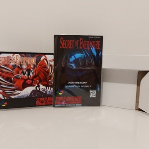 May include: A Super Nintendo game cartridge and instruction booklet for the game "Secret of Evermore". The game cartridge is black with a red and white label featuring a large red monster with claws. The instruction booklet is black with a blue and white label featuring a blue butterfly.