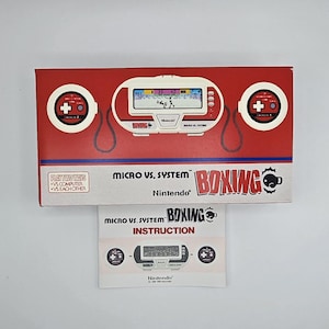May include: A red and white Nintendo Micro vs. System Boxing game console box and instruction manual. The box features a game screen graphic, two controllers, and the game title. The instruction manual shows the console and controllers.