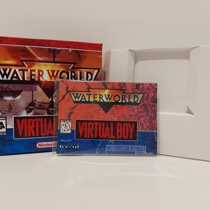 May include: A red, white, and blue box for the Virtual Boy video game Waterworld. The box has the game title "Waterworld" and the words "Virtual Boy" on it. The game is rated "KA" for Kids to Adults.