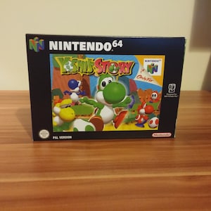 May include: A Nintendo 64 game cartridge case for Yoshi's Story. The case is black with a colourful image of Yoshi and other characters on the front. The text "Nintendo 64" is printed in white on the top of the case. The text "Yoshi's Story" is printed in white on the front of the case. The text "PAL Version" is printed in white on the bottom of the case.