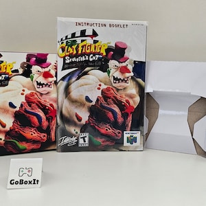 May include: A Nintendo 64 game box for ClayFighter: Sculptor's Cut. The box features a white and red clay figure of a clown with a red hat and a white face. The game is rated T for Teen by the ESRB.