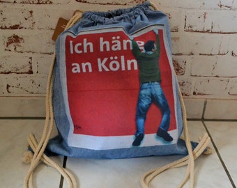 Tasche Turnbeutel Rucksack Sportbeutel aus recycelter Baumwolle mit weisser Kordel, Druck "Ich häng an Köln"