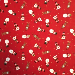 May include: Red fabric featuring a festive pattern of Santa Claus, snowmen, and reindeer. The Santa figures are in red suits and hats, the snowmen have white bodies and black hats, and the reindeer are brown. Small gold stars are scattered across the design.