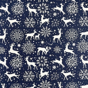 May include: A navy blue fabric with a white repeating pattern of snowflakes and stylised deer. The pattern is a classic Christmas design.
