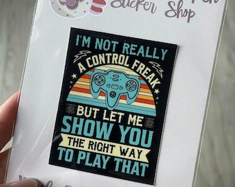 May include: A black and white vinyl sticker with a retro video game controller graphic and the text "I'm not really a control freak, but let me show you the right way to play that".