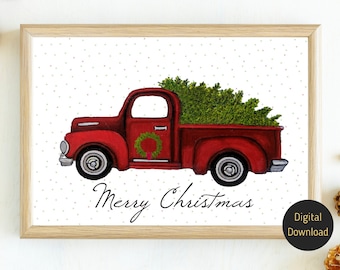 May include: Watercolor print of a red vintage truck carrying a Christmas tree, with a wreath on the door. The words "Merry Christmas" are written below the truck. The background is white with small gray dots. The print is in a light wood frame.