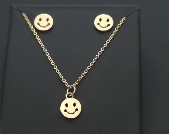 smilley face  set charm with necklace, and  matching earrings 14k yellow gold