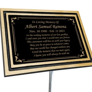 May include: A black and gold memorial plaque with a poem inscribed in gold lettering. The plaque reads "In Loving Memory Of Albert Samuel Ramona Nov. 30 1990 - Feb. 12 2023 In the waking moments of our last goodbye, I said unto you that I would miss you forever. This statement will live on with your legacy. May you be at peace in whatever comes, But our world has changed without you. Until the moment that we meet again, I know you will always be with me."