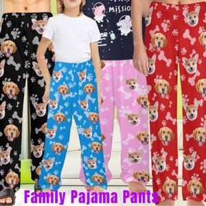May include: A set of four pairs of pajama pants featuring a dog face pattern. The pants are in black, blue, pink, and red. The text "Family Pajama Pants" is at the bottom of the image.