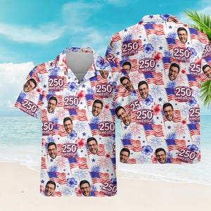 May include: White Hawaiian shirt with a repeating pattern of American flags, fireworks, and the text "250 AMERICA". The shirt also features a repeating image of a smiling person. The shirt has short sleeves and a button-down front.