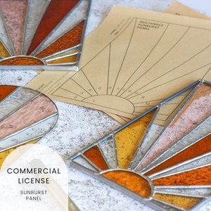 May include: Three stained glass sunburst panels in shades of orange, yellow, and pink. The panels are framed in silver metal and have a textured glass finish. The image also includes a printed pattern for creating a sunburst panel.