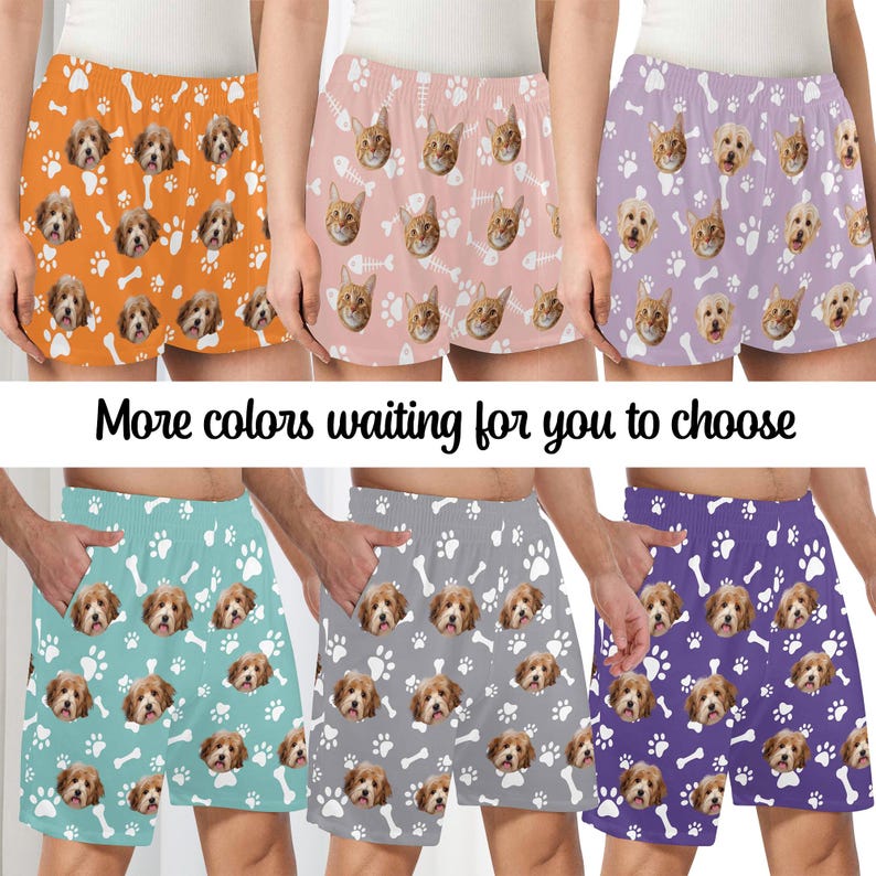 K&ouml;nnte beinhalten: Eine Kollektion von sechs Shorts in Orange, Hellrosa, Helllila, T&uuml;rkis, Grau und Dunkellila, die jeweils ein wiederkehrendes Muster aus Hunde- oder Katzengesichtern zeigen, durchsetzt mit wei&szlig;en Pfotenabdr&uuml;cken und Knochen- oder Fischgr&auml;tensymbolen.
