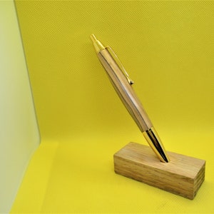 120-2A Hand crafted 24K gold push button type pen . Made from olivewood from Israel.