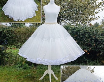 May include: White tulle petticoat with a satin ribbon trim. The petticoat is 30 inches (75 cm) long.