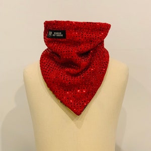 May include: Red sequined bandana with a black label that says "Fleece by Reese".