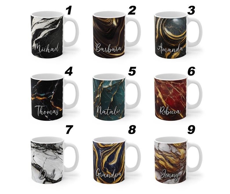 May include: Nine white ceramic mugs with different marble-inspired designs and gold accents. Each mug has a name written on it: Michael, Barbara, Amanda, Thomas, Natalie, Rebecca, Dad, Grandpa, and Jenny.